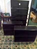 All three shelving units arranged together on floor