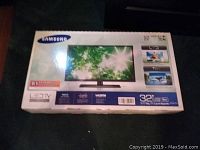 Original box of Samsung 32 inch LED TV with model and feature details.