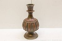 Full view of the bronze enamel vase showing shape and base