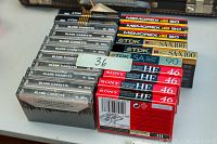 Photo showing Sony, Memorex, and TDK blank audio cassette lots, some sealed, some unsealed.