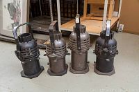 Four Altman stage lights arranged in a row showing overall condition and design.
