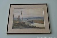 Framed seascape print depicting boats on water, signed Margaret Wilson 1889, with beige mat and thin black frame.