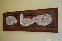 Wooden abstract bird art panel in brown and white wood, rectangular, signed 'DeGroot'