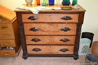 Frontal view of dresser with decorative items on top