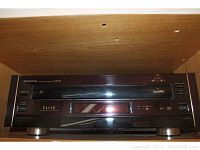 Front view of Pioneer Elite CLD-95 in wooden shelf