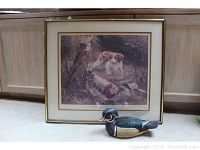 Framed Robert Abbett print with hunting dog and nearby wood duck decoy