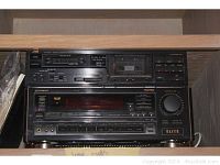 Front view of the stacked Pioneer Elite stereo receiver VSX-52 at bottom and JVC TDX-301 cassette deck at top, showing buttons and display panels.