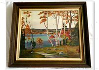 Framed acrylic painting of fall lake landscape with trees, signature visible in lower right, view of entire framed artwork.