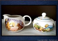 Photo showing both the creamer and the lidded sugar bowl decorated with Classic Pooh illustrations