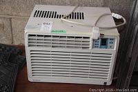 Front view of Danby window air conditioner showing vents, control panel, and attached power cord.