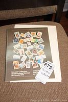 Photo of the souvenir collection cover for the 1976 Canadian postage stamps with various colorful stamp images showcased on the front cover.