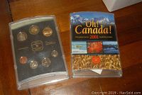 Pair of 2001 Canadian uncirculated coin sets, one with colorful insert cover, one without insert