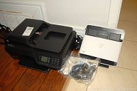 HP Officejet 4620 multi-function printer with power cable and some accessories on the floor next to the Neat scanner.