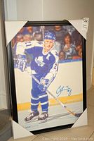 Full framed canvas print of Borje Salming in Toronto Maple Leafs uniform on ice, signed and numbered.