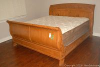 Full view of king size bed frame with mattress
