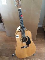 Front view of Norman Model B50 acoustic guitar on stand
