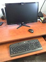 front view of monitor with keyboard and mouse on desk
