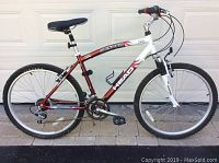 Side view of Head Crusader men’s mountain bike showing frame, suspension, wheels and drivetrain