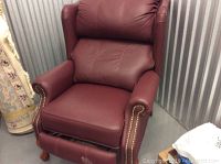 Front view of burgundy leather recliner upright