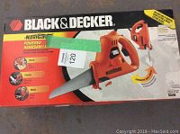 Original boxed Black & Decker NaviGrip powered handsaw jig saw showing product info and intended materials for cutting such as wood, plastic, metal.