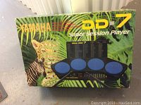 Box of Yamaha DD-7 Super Session Player with jungle theme and animal images including zebra and tiger