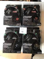 Eight new iHip Pro DJ headphones in packages, 4 Calgary Flames and 4 Vancouver Canucks editions visible in packaging with team logos and colors