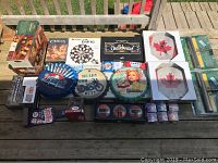 Overview of all items including games, wall decor, bottle opener, and tins