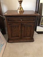 Front view of bedside cabinet showing drawer and double doors