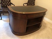 Front angle view showing leather top inset and bookshelf