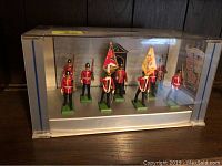 Seven Britains toy soldiers of Middlesex Regiment displayed in original clear plastic case with label.