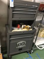 Two-piece gray Craftsman rolling tool chest with 80 Years Special Edition badge