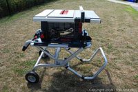 Full overview of Bosch 4000 table saw mounted on TS2000 folding stand outdoors.