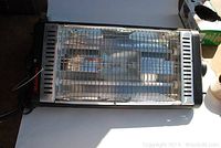 Front view of Marvin garage heater showing heating elements behind metal grill and black casing sides with vents.