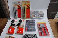 Full view of all woodworking tools laid out including clamps, blades, protractor, and accessories