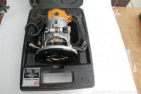 Black & Decker Model 3310 router in its carrying case showing the router and case interior.