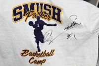 Close-up photo of the t-shirt's back showing the Smush Parker Basketball Camp graphic and autographs.