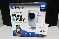 Photo of SwannEye HD Plug & Play Wi-Fi HD Security Camera box with front view showing product image and features.