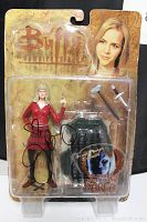 Front view of the autographed Darla action figure still sealed in original packaging showing the character and accessories clearly.