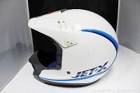 Left side view of Shoei Jetex white motorcycle helmet showing shell design and colors