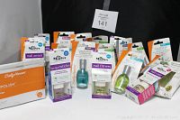 Front view of the lot showing Sally Hansen Salon Gel Polish kit and various Dr. Marve nail care products in sealed packaging.