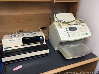 Toshiba DP80F fax machine and copier shown with numeric keypad and document feeder tray on countertop