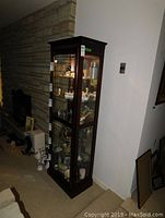 Full front view showing five glass display shelves and interior light