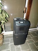 Front view of a black Danby Designer portable air conditioner with digital control panel and air vents.