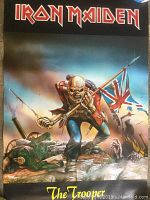 The Trooper poster showing Eddie in military uniform with Union Jack flag, visible wrinkles and small tears