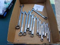 Top view of 15 Craftsman combination wrenches arranged in a box showing sizes and branding clearly