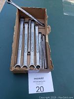 9 Craftsman box end wrenches arranged in cardboard box showing various sizes