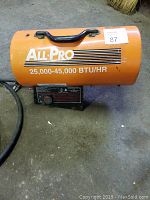 Orange All Pro propane heater with handle and BTU rating visible on side.