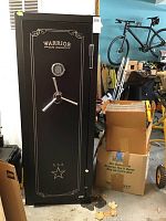 Front exterior view showing full safe body, painted decorative trim, keypad and three-spoke handle