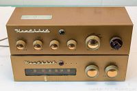 Photo showing front view of Heathkit pre amplifier and tuner stacked, gold-tone metal housing, control knobs visible