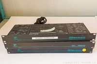 Three Yorkville Sound Elite series rack-mount audio processing units stacked, showing front edge and model numbers P2003 and P2000.